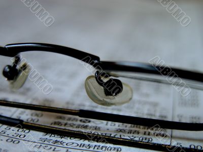 Glasses On The Newspapers