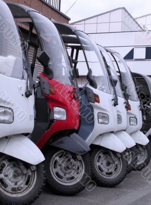 Scooter in a row