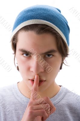 Boy with finger on mouth