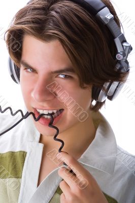 Boy biting a cable
