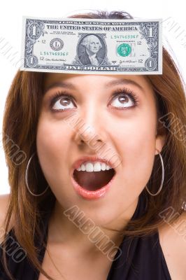 Beautiful Brunette with dollar bill on face