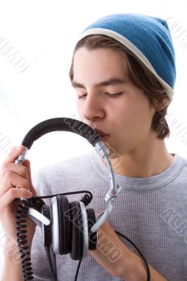 Boy kissing his headphones