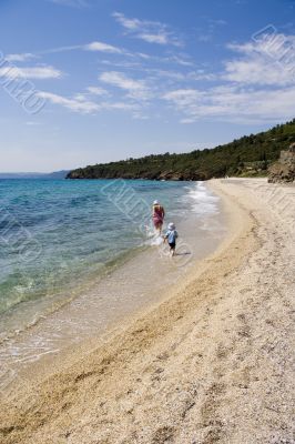 Ma with child on beach