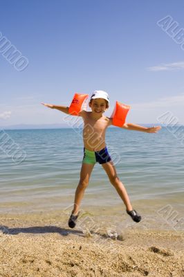 Child jump on seacoast
