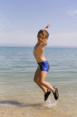 Child jump on seacoast