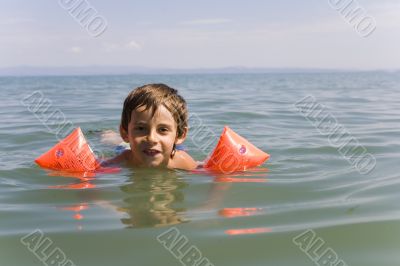 Boy learns swiming