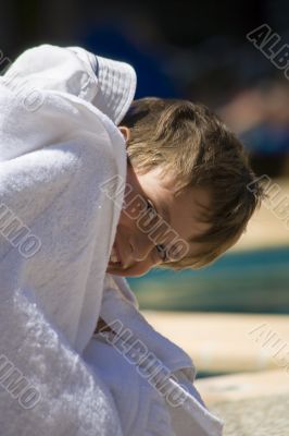 portrait of the boy beside swimming pool