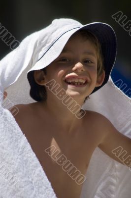 portrait of the boy beside swimming pool
