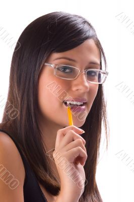 Brunette biting a pencil