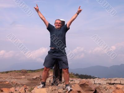 Happy man in the mountain top
