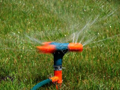 Moving streams sprayer watering lawn