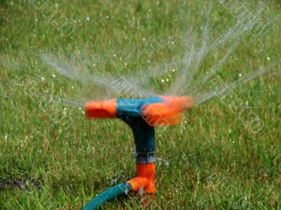 Moving streams sprayer watering lawn
