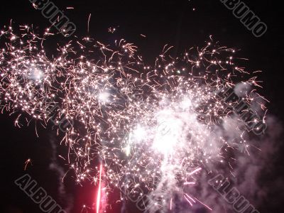 Night celebration fireworks upon dark sky