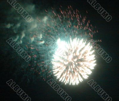 Night celebration fireworks upon dark sky