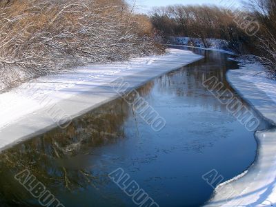 Winter snowy morning riverside