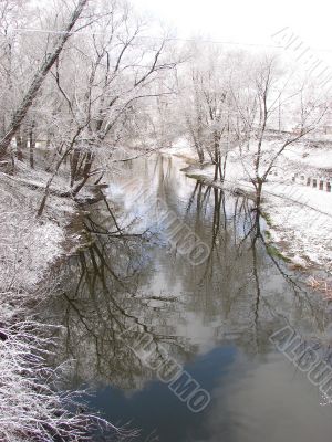 Spring snowy morning riverside