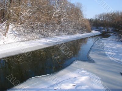 Winter snowy morning riverside