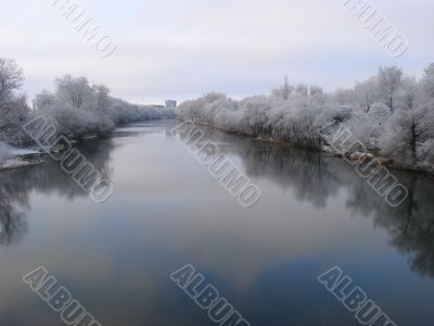 Spring snowy morning riverside