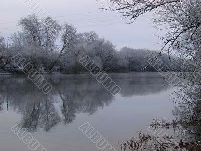 Spring snowy morning riverside