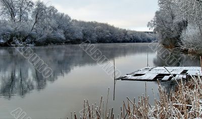 Spring snowy morning riverside