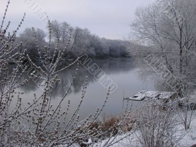 Spring snowy morning riverside