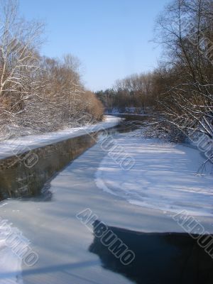 Winter snowy morning riverside