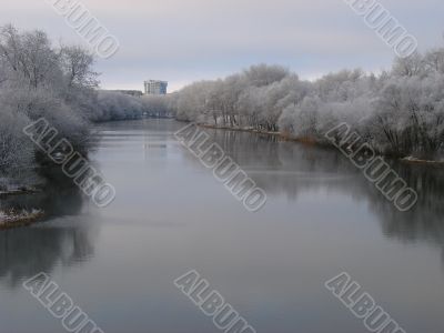 Spring snowy morning riverside