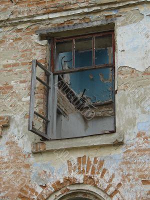Alone window of aged ruined urban building