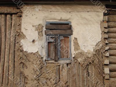 Alone window of aged ruined urban building