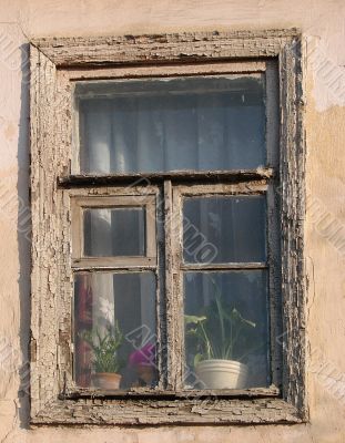 Alone window of aged ruined urban building