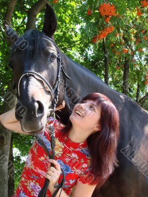 Brunette female model with horse