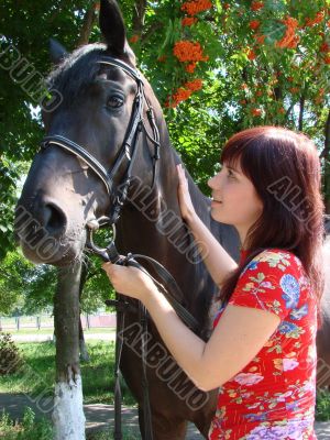 Brunette female model with horse