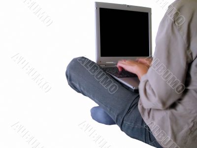 Girl typing on a laptop