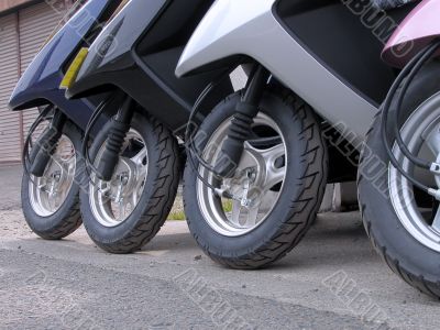 Scooter wheels in a row Scooter wheels in a row