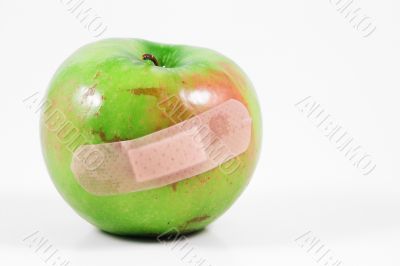 apple with bandaid