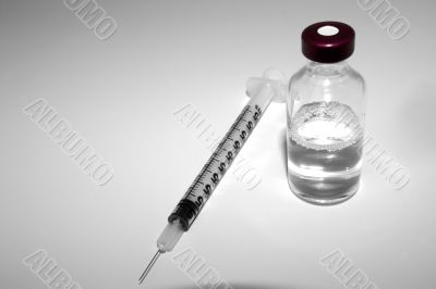 medicine vial and syringe