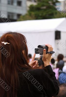 Woman recording an event