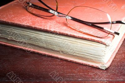 old book and glasses