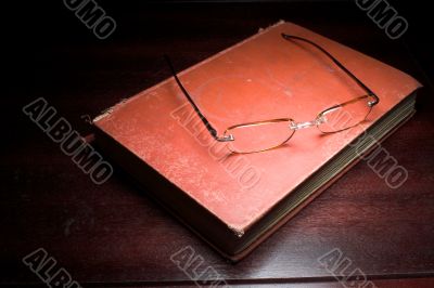 old book and glasses