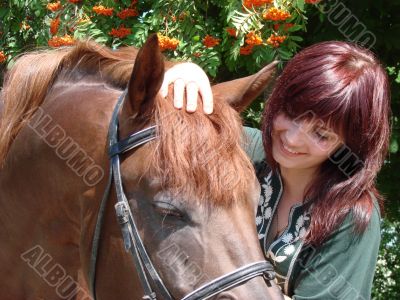 brunette female model closeup with brovn horse