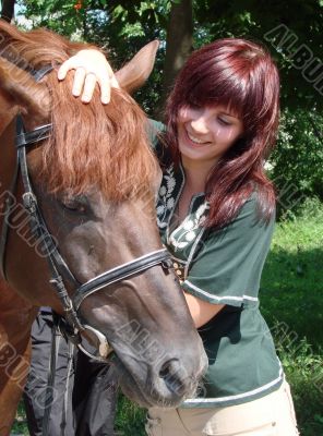 Brunette female model with black horse