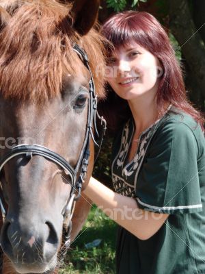 Brunette female model with black horse