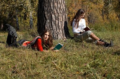 Girls reading  in the park