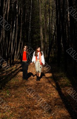 Girls walking in the forest