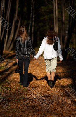 Girls walking in the forest