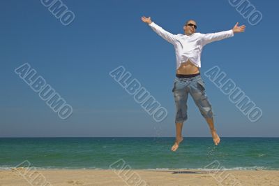 Man jumping on the beach