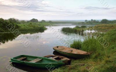 boats beside riverside matutinal landscape