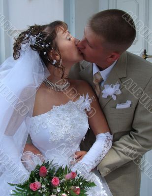 Wedding Kiss of Young Just Married Couple