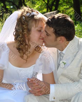 Wedding Kiss of Young Just Married Couple