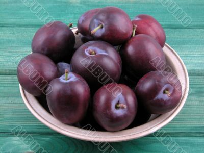 bowl full of fresh plums